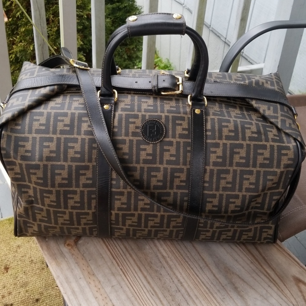 Authentic Fendi travel bag with lock and strap